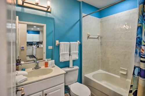 a bathroom with a sink and a toilet and a shower at Waterfront Palm Coast Condo with Boat Dock and Pool! in Palm Coast