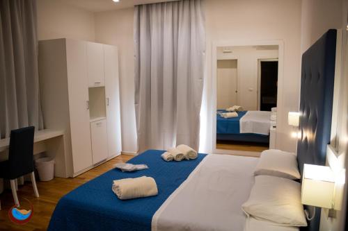 Tempat tidur dalam kamar di Beauty House Via Veneto