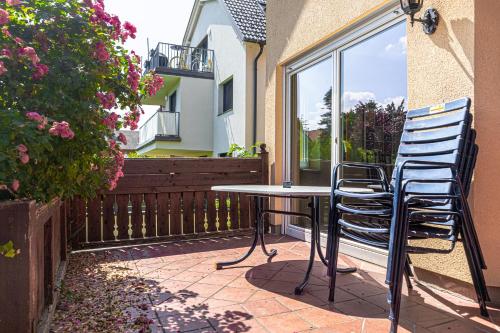 a table and two chairs sitting on a patio at Exquisite Shared Villa - Your Private Room in this Beautiful Home in Vienna