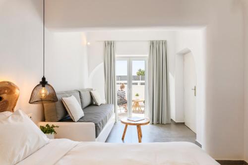 Ένα ή περισσότερα κρεβάτια σε δωμάτιο στο Casa Anna Suites