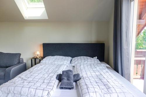 a bedroom with a bed with towels on it at Exquisite Shared Villa - Your Private Room in this Beautiful Home in Vienna