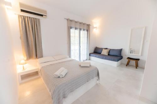 Кровать или кровати в номере Muses Apartments