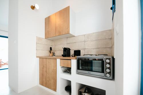 Кухня или мини-кухня в Muses Apartments
