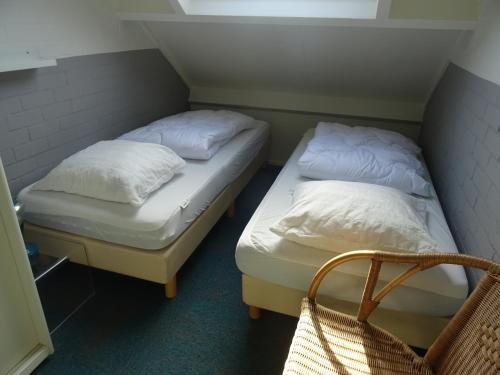 Postel nebo postele na pokoji v ubytování Kustverhuur, Park Schoneveld, Duinroos 099