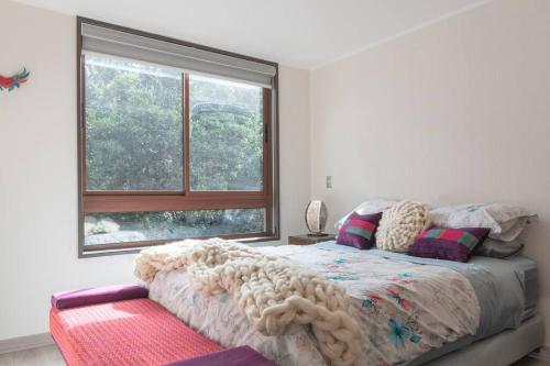 Ένα ή περισσότερα κρεβάτια σε δωμάτιο στο Excelente Departamento en Condominio Costa Pucon