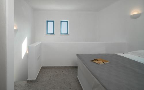 Postel nebo postele na pokoji v ubytování Camvillia Donoussa Village Suites