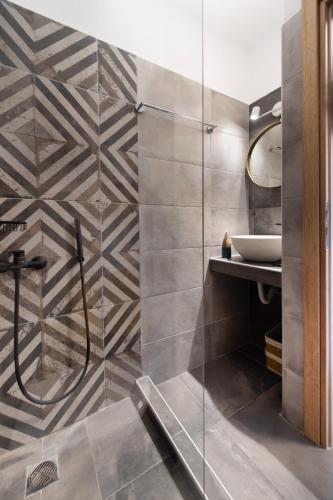 a bathroom with a shower and a sink at Melodia Lefkada Maisonette 1 in Nikiana
