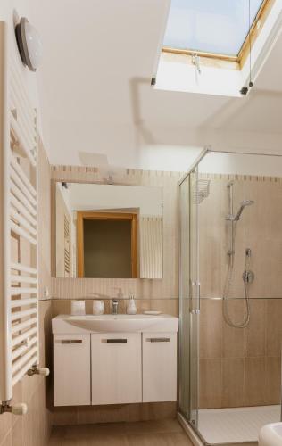 a bathroom with a sink and a shower at La Collina sul Mare Apartments in Petacciato