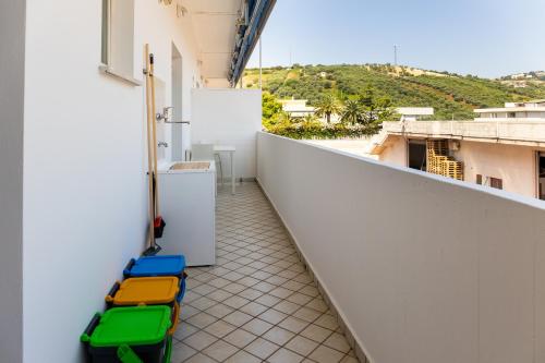 a balcony with a row of luggage on the side of a building at Smart and Sea in Tortoreto Lido