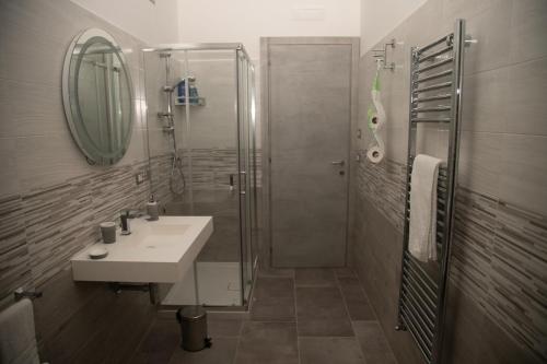 a bathroom with a sink and a shower at Il Violino degli Dei Holiday House in Agerola