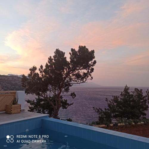 a view of the ocean from the roof of a house at Akropolis Village Complex of Luxury Residence in Karpathos Town