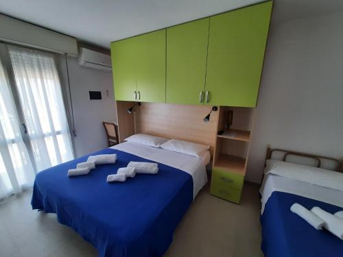 Llit o llits en una habitació de Hotel Barbiani