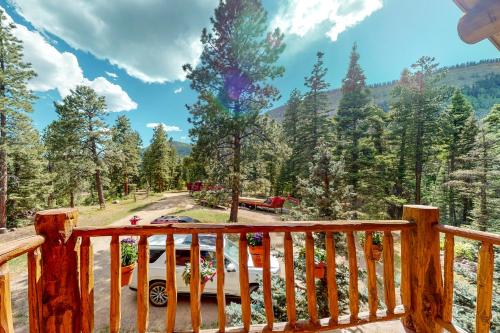 a view from the deck of a cabin with a truck at Durango Dreams in Durango