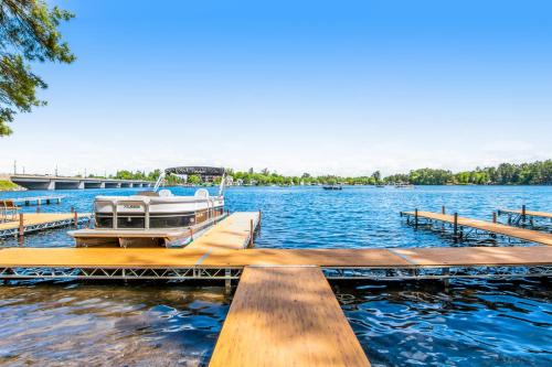 a boat is docked at a dock on a lake at Lake Minocqua Lakeview in Minocqua