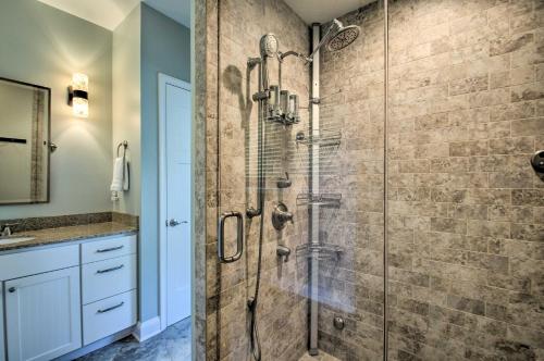 a shower in a bathroom with a glass shower stall at Grand Chalet with Hot Tub - Near Wintergreen Resort in Wintergreen