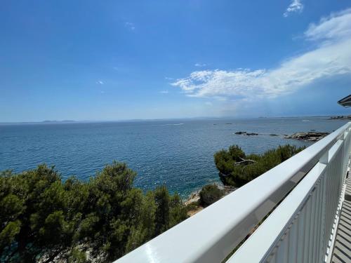 a view of the ocean from the balcony of a house at OverTheSea - PUEBLECITO Apartment in Roses