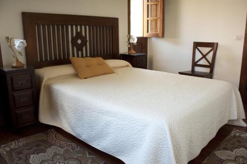 Giường trong phòng chung tại Casa Rural Llano Campo