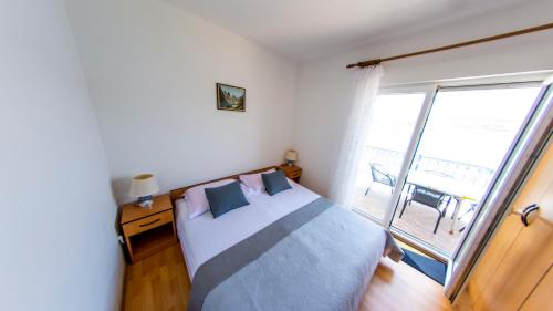 Posteľ alebo postele v izbe v ubytovaní Planikovica Apartments