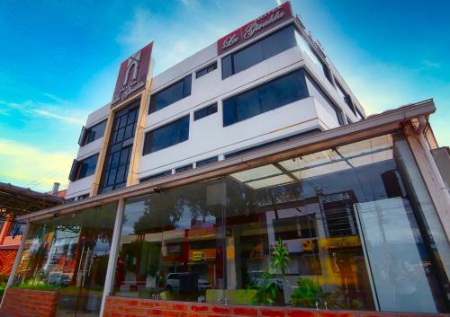 a building with glass windows in front of it at Hotel la Giralda in Ibarra