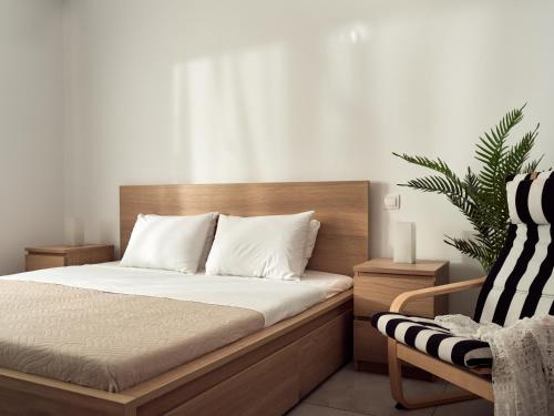 Postel nebo postele na pokoji v ubytování Margie City Apartment
