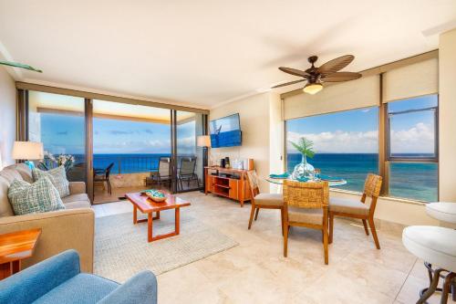 a living room with a view of the ocean at Maui Kai 908 Oceanfront 1 Bedroom condo in Kahana