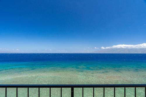 a view of the ocean from a balcony at Maui Kai 908 Oceanfront 1 Bedroom condo in Kahana