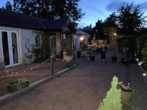 a house with christmas lights in the yard at Ballybur Lodge Mews 1 in Kilkenny