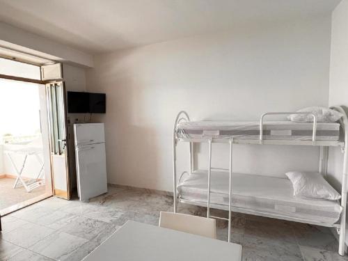 Двухъярусная кровать или двухъярусные кровати в номере Residence Tramonto