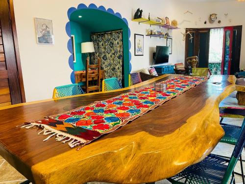 a wooden table with a rug on top of it at Casa Boho 1 in Sayulita