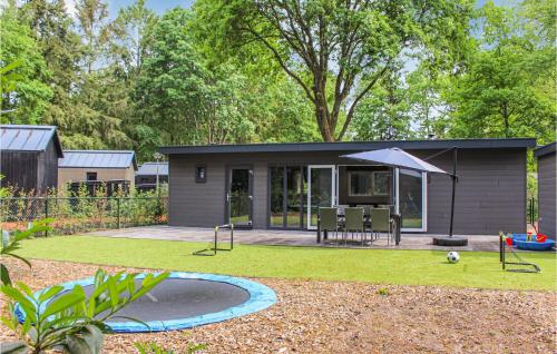 a tiny house with a playground in the yard at 3 Bedroom Pet Friendly Home In Epe in Epe