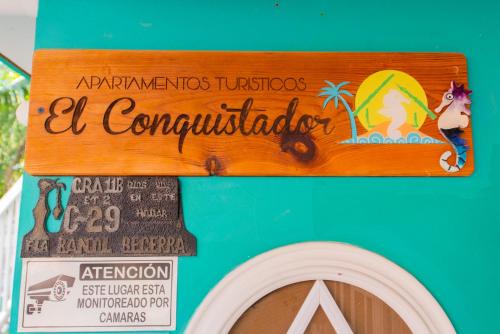 a sign on the side of a food truck at Apartamentos Turísticos El Conquistador in San Andrés