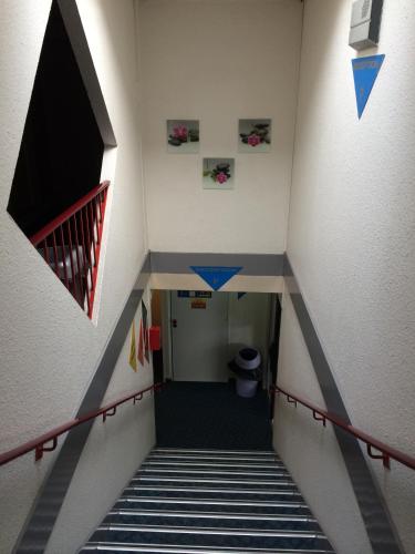 a view of a staircase in a building at Formul'Eco in Louvroil