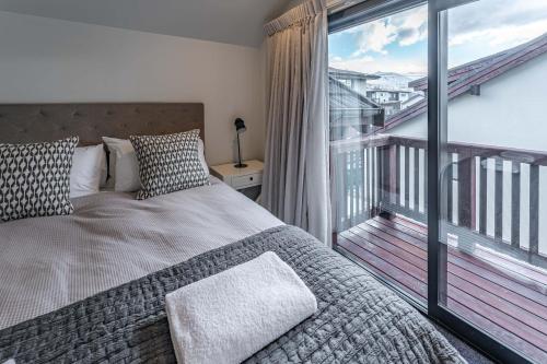 A bed or beds in a room at Tranquil Stream Side Retreat