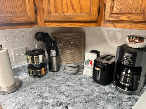 a kitchen counter top with a coffee maker and appliances at The Perfect 3 Bedroom Apartment - Central location in Fairbanks