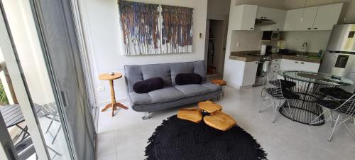 a living room with a couch and a table at Pedacito de cielo in Progreso