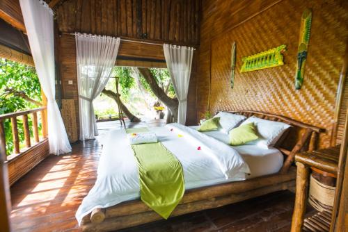 Posteľ alebo postele v izbe v ubytovaní Gading Tree House