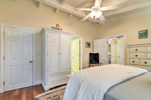 a bedroom with a bed and a ceiling fan at Charming Hyannis Cottage 1 Mi to Beach! in Hyannis