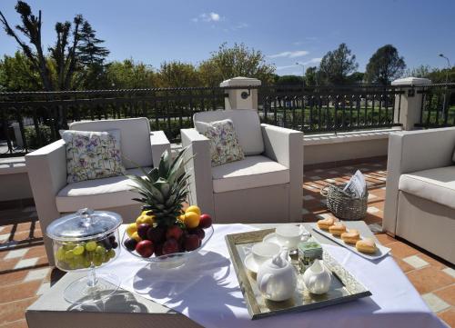a table with a tray of fruit on a patio at San Giovanni Relais in San Giovanni in Marignano