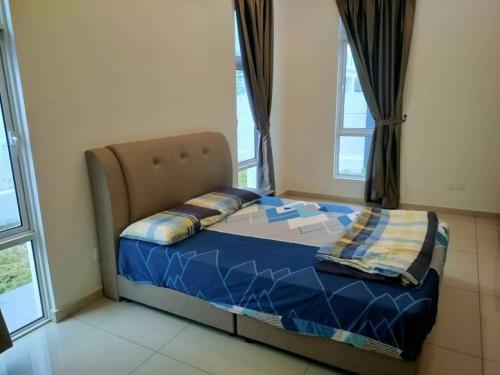 a small bed in a room with windows at My Home Kayangan Villa Malacca C10 in Melaka