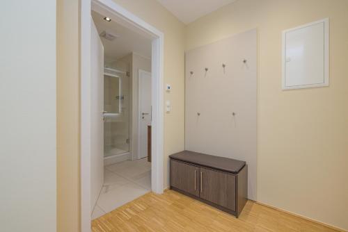 a bathroom with a vanity and a walk in shower at Vienna Stay Apartments Linzerstrasse in Vienna