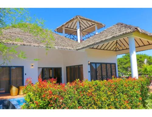 a view of a house with a roof at Safari Hotel and Villas powered by Cocotel in Vigan