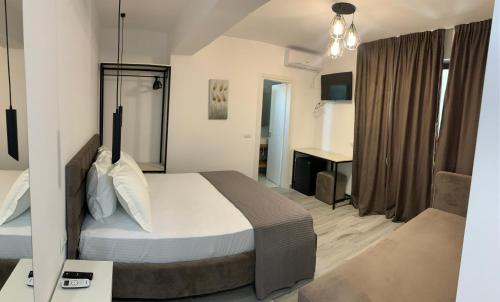 Ένα ή περισσότερα κρεβάτια σε δωμάτιο στο Kekezis Apartments