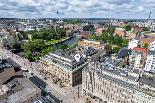 an aerial view of a city with a river and buildings at "PENTHOUSE" - Renovated 1BR Apt with Sauna & 60m2 Private Terrace, Hosted by 2ndhomes in Tampere