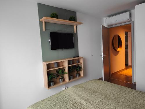 A bed or beds in a room at Beachfront Paradise Ezüst Panoráma lakeview apartment with panoramic terrace