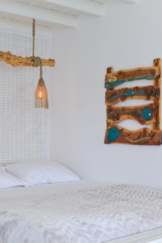 a bedroom with a bed and a picture on the wall at Fisherman's Syrma House in Pachaina