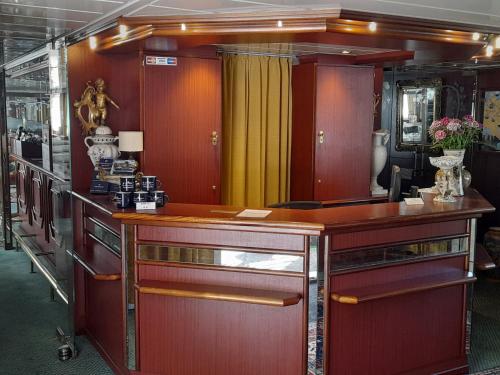 a room with a wooden counter in a room at River hotel KÖNIGSTEIN in Prague