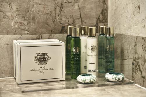 a picture of four bottles ofodorizers on a counter at Ambassador Palace Hotel in Udine