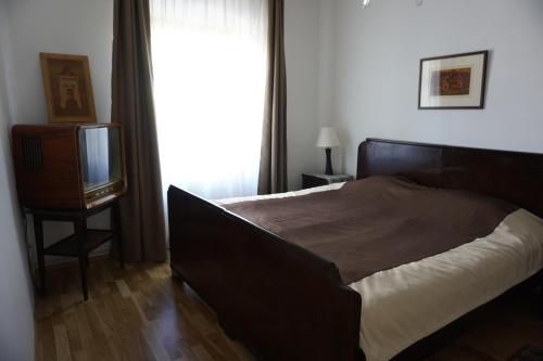 Una cama o camas en una habitación de Pont Vendégház