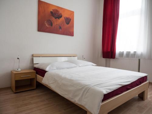 Ένα ή περισσότερα κρεβάτια σε δωμάτιο στο Hotel Westend