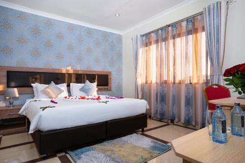 Postel nebo postele na pokoji v ubytování West Lerruat Hotel